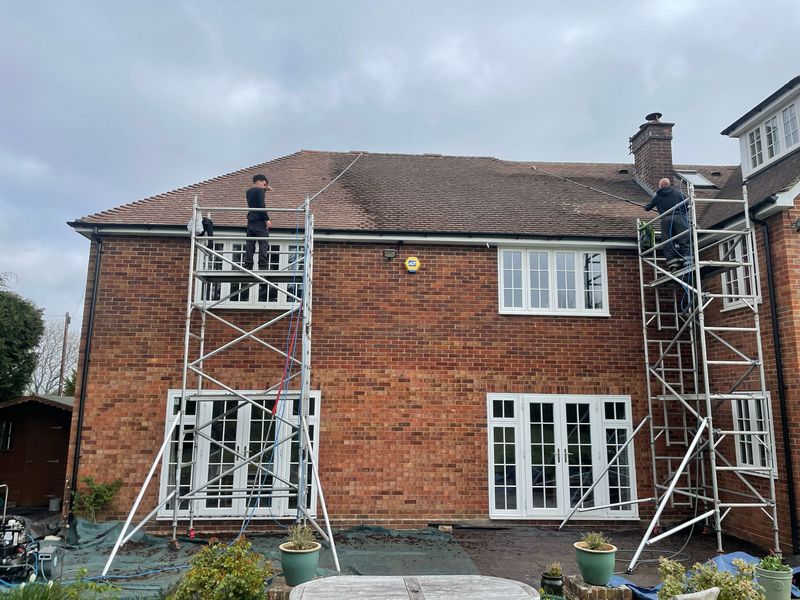 Roof cleaning carried out safely from scaffold towers by The Roof Moss Cleaners in Thame